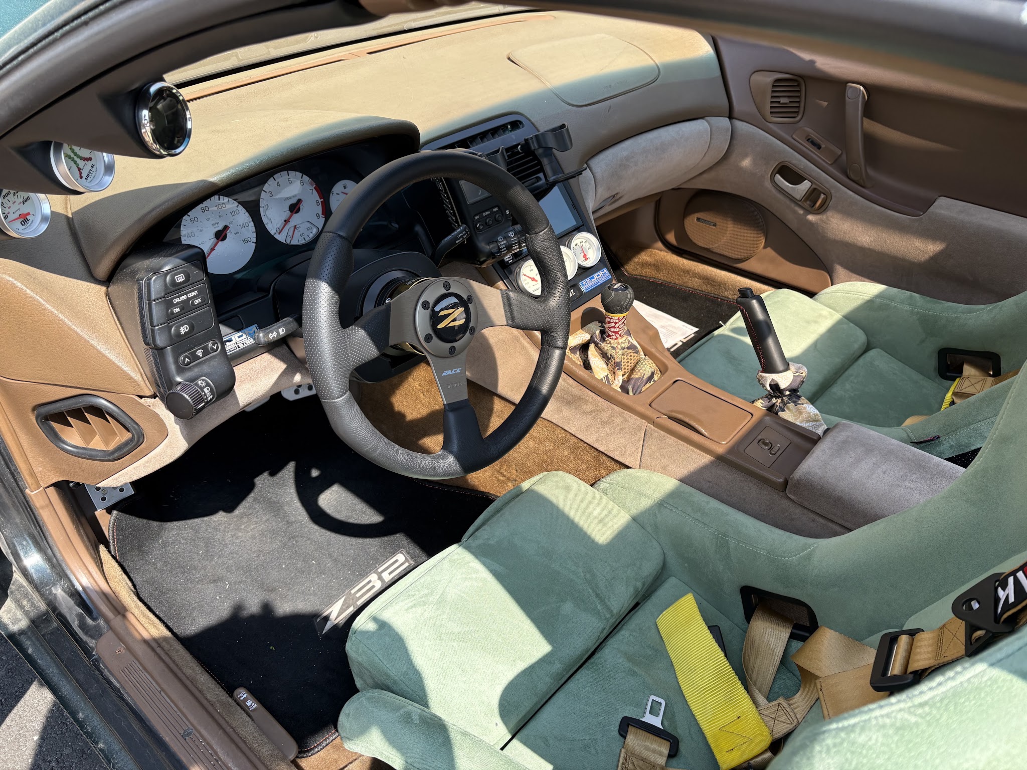 Interior of a Nissan 300ZX with bucket seats and a steering wheel